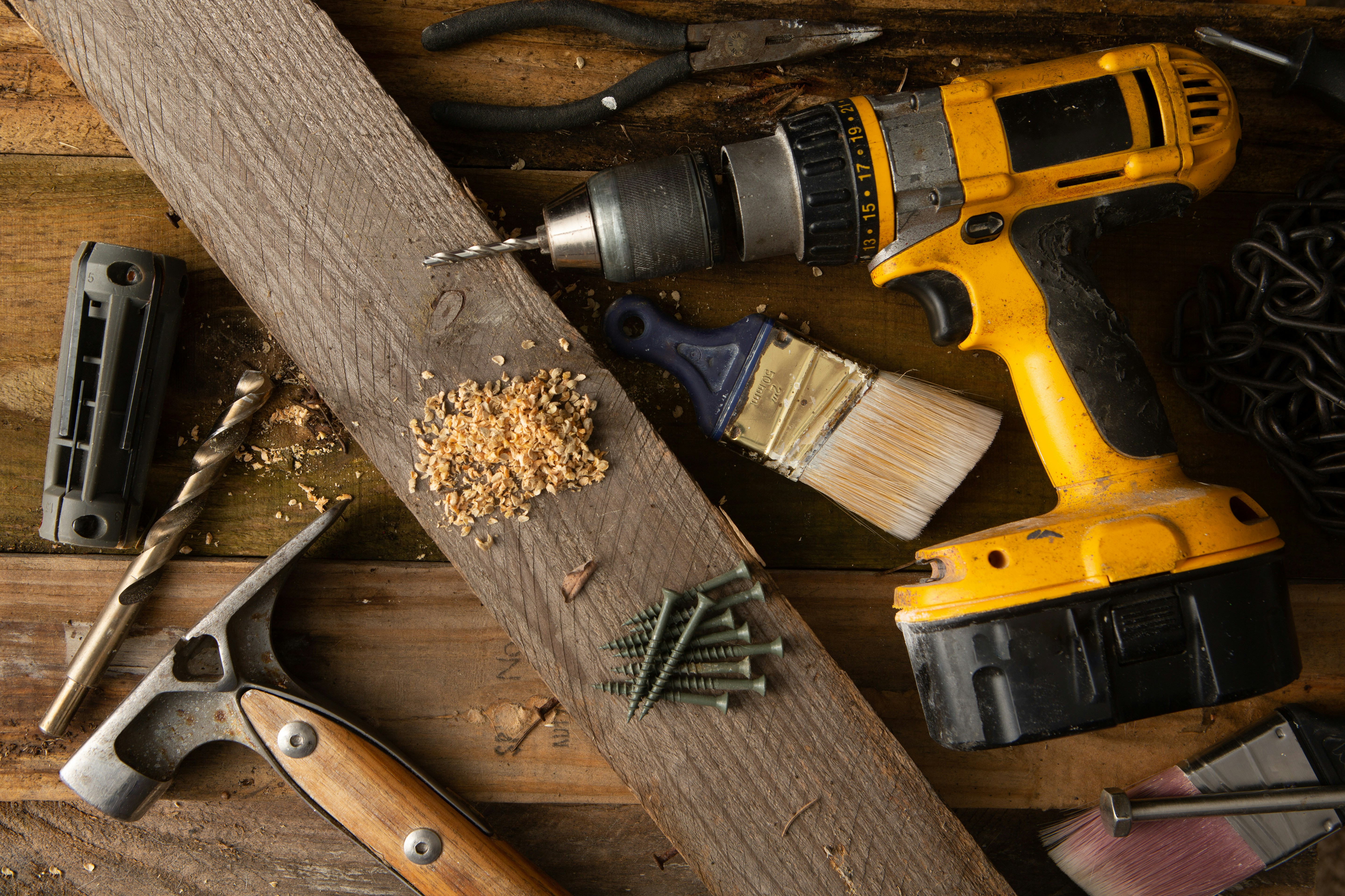 A workbench with an assortment of woodworking tools.